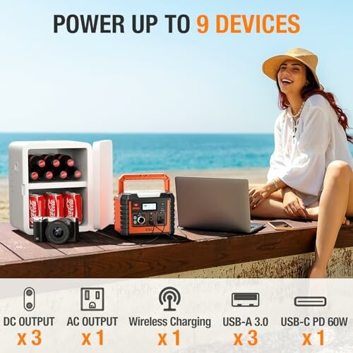 Woman on beach with portable power station charging multiple devices.