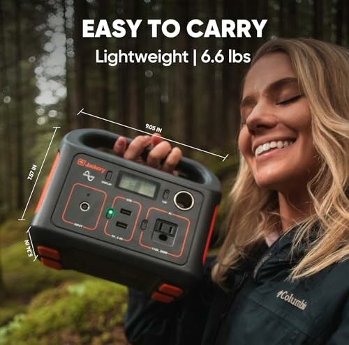 Woman holding a portable power station in a forest, labeled easy to carry and lightweight at 6.6 lbs.